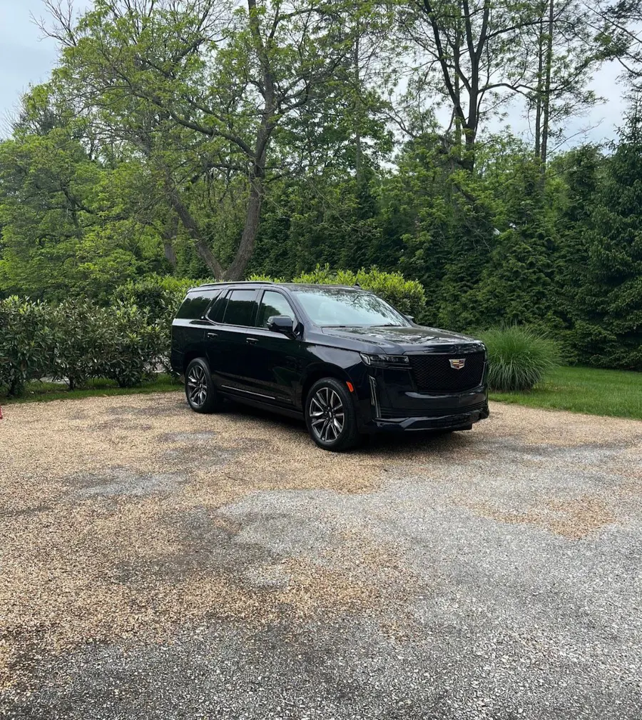 Black Cadillac Escalade delivered at a client's home